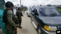 Troopers man a checkpoint near the site where a bomb exploded in Marawi, southern Philippines, Dec. 3, 2023. 