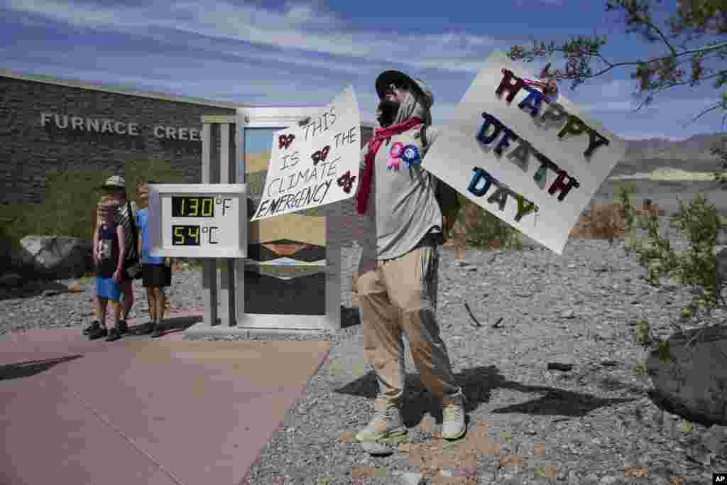 A demonstrator protests visitors to Death Valley National Park, July 16, 2023, in Death Valley National Park, California.&nbsp;Death Valley&#39;s brutal temperatures come amid a blistering stretch of hot weather that has put roughly one-third of Americans under some type of heat advisory, watch or warning.