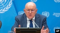 In this photo provided by the United Nations, Ambassador Vassily Nebenzia, permanent representative of the Russian Federation, and president of the Security Council for the month of July, briefs reporters at the U.N., July 1, 2024.