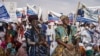 Des partisans du président sortant Mohamed Ould Cheikh El Ghazouani, chef de l'Union pour la République, lors du dernier rassemblement de campagne à Nouakchott, en Mauritanie, le 27 juin 2024. (Photo de JOHN WESSELS/AFP).