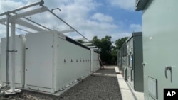 FILE - A NineDot Energy Tesla Megapack battery storage site is seen in the Bronx Borough of New York City, Aug 9, 2022. (Business Wire via AP)
