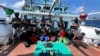Indian commandos stand guard with a group of detained pirates after the Indian navy freed an Iranian fishing vessel hijacked by Somali pirates, off the Somali coast, west of Kochi, India, Jan. 30, 2024. (Indian navy photo)