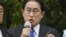Japanese Prime Minister Fumio Kishida delivers a speech to support his ruling party’s candidate in a local election, near a train station in Wakayama, western Japan, April 15, 2023.