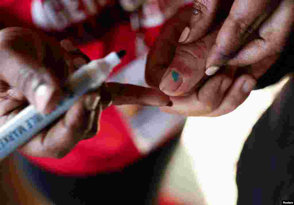 A person's finger is marked at a polling station during the Eswatini's parliamentary elections in Mbabane, Eswatini.