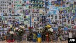 Ahead of the second anniversary of Russia&#39;s invasion of Ukraine, &quot;The Wall of Remembrance of the Fallen for Ukraine&quot; stands as a memorial for Ukrainian soldiers in downtown Kyiv. (Photo by Roman PILIPEY / AFP)
