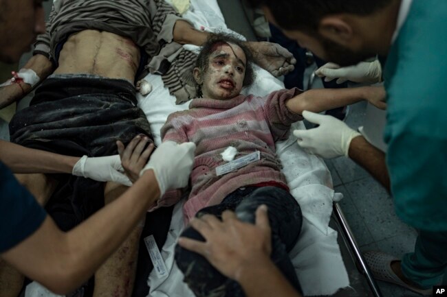 Palestinians wounded in the Israeli bombardment of the Gaza Strip arrive at a hospital in Rafah, Dec. 6, 2023.