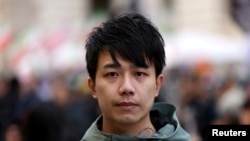 Finn Lau, a Hong Kong political activist, attends a rally in solidarity with Hong Kong residents, in London, March 23, 2024.