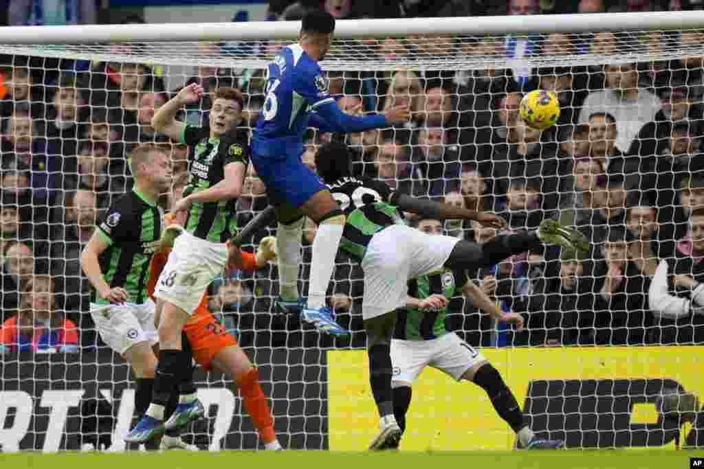 Chelsea&#39;s Levi Colwill, top center, scores his side&#39;s second goal during the English Premier League soccer match between Chelsea and Brighton and Hove Albion, at Stamford Bridge stadium in London.