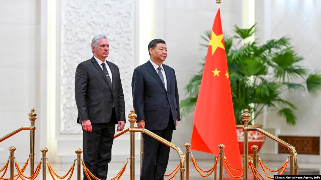 FILE - Cuba's President Miguel Diaz-Canel Bermudez, left, and Chinese President Xi Jinping stand during a welcome ceremony at the Great Hall of the People in Beijing, Nov. 25, 2022. 