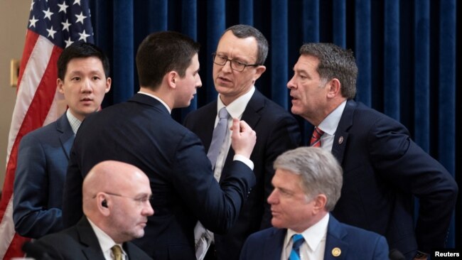 Chairman Representative Mark Green, standing far right, speaks with staff during a House Homeland Security Committee meeting to vote on impeachment charges against Department of Homeland Security Secretary Alejandro Mayorkas in Washington, Jan. 30, 2024.