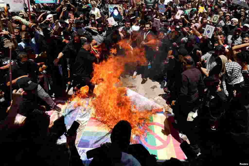 Supporters of Iraqi Shi'ite cleric Muqtada al-Sadr take part in a protest after the embassy was stormed and set on fire ahead of an expected Koran burning in Stockholm, in Baghdad, Iraq.