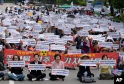 South Korean fishermen stage a rally against Japanese government's decision to release treated radioactive water from Fukushima nuclear power plant, in front of the National Assembly in Seoul, South Korea, Monday, June 12, 2023. (AP Photo/Ahn Young-joon)