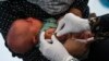 Seorang bayi menerima vaksin tuberkulosis Bacillus Calmette-Guerin (BCG) saat program imunisasi nasional di Banda Aceh, 9 Juni 2022. (Foto: AFP)