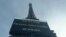 A board informs visitors that the site is closed after staff went on strike, at the bottom of the Eiffel Tower in Paris, Dec. 27, 2023.