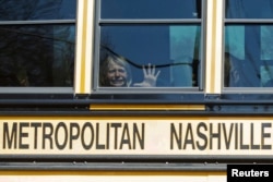 A child weeps while on the bus leaving The Covenant School, following a mass shooting at the school in Nashville, Tennessee, March 27, 2023. (Nicole Hester/USA Today Network via Reuters)