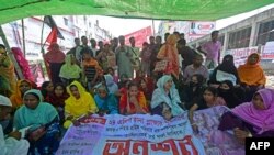 Victims of the Rana Plaza garments factory tragedy stage a hunger strike on its 10th anniversary at the site where the building once stood in Savar on the outskirts of Dhaka on Apr. 24, 2023.