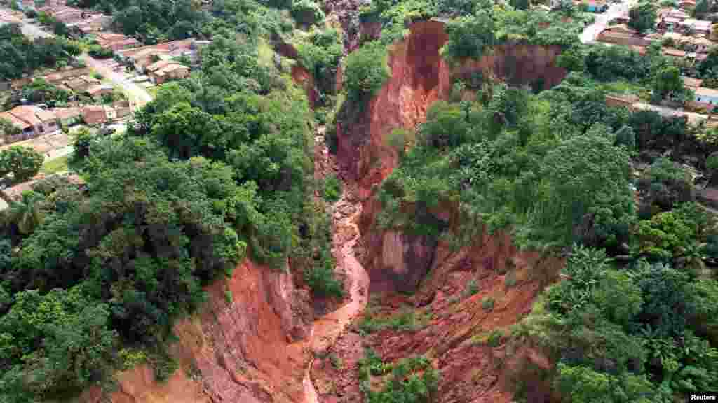 This image from above shows a hole created by landslides in past years and increased due to recent heavy rains, in Buriticupu in Maranhao state Brazil, March 28, 2023.