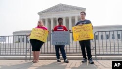 People in favor of canceling student debt protest outside the Supreme Court, June 30, 2023, before the Court ruled that the Biden administration overstepped its authority in trying to cancel or reduce student loans for millions of Americans.