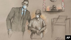 FILE - This photo of an artist rendering shows Mario Antonio Palacios Palacios with his attorney Alfredo Izaguirre before U.S. Magistrate Judge Jacqueline Becerra in federal court, Feb. 4, 2022, in Miami, Florida. 