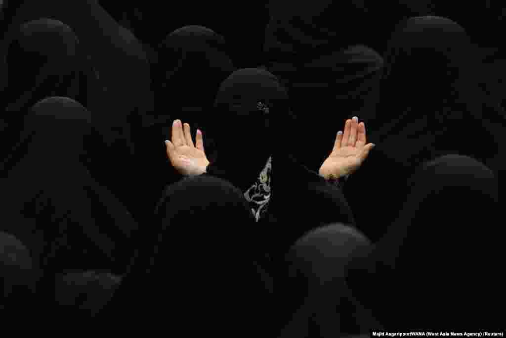 Iranian Shi&#39;ite Muslim women take part in a mourning tradition ahead of Ashura, the holiest day on the Shi&#39;ite Muslim calendar, in Tehran.