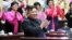 FILE - North Korea's leader Kim Jong Un applauds at the 5th National Meeting of Mothers in Pyongyang in this picture released by the Korean Central News Agency on Dec. 4, 2023. (KCNA via Reuters)