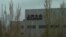 FILE - A Volkswagen factory sits on the outskirts of Urumqi in in western China's Xinjiang Uyghur Autonomous Region on April 22, 2021. 
