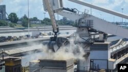 FILE - Grain is offloaded from the Eaubonne bulk carrier ship after it docked in the port of Mombasa, Kenya. Taken Nov. 26, 2022. 