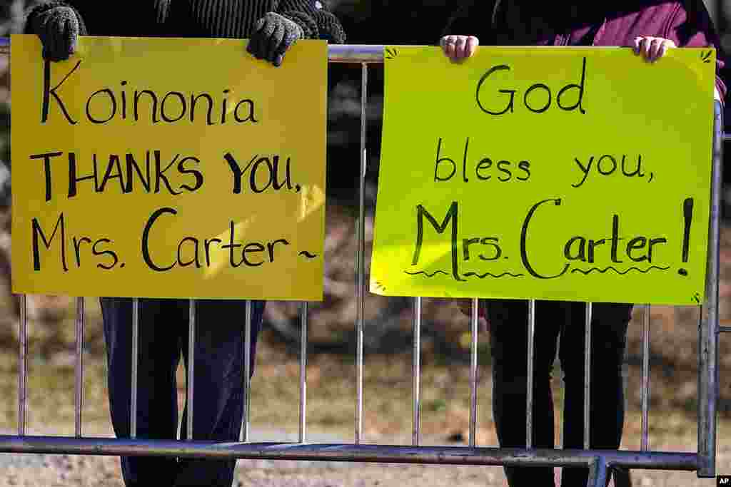 People watch the motorcade as it moves to Maranatha Baptist Church where the funeral service for former first lady Rosalynn Carter will be held, in Plains, Georgia, Nov. 29, 2023.&nbsp;The former first lady died on Nov. 19. She was 96.&nbsp;With her frail husband as a silent witness, Rosalynn Carter was celebrated by her family and closest friend at her funeral in the same tiny town where she and Jimmy Carter were born, forever their home base as they climbed to the White House and traveled the world for humanitarian causes.