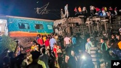 Rescuers work at the site of passenger trains that derailed in Balasore district, in the eastern Indian state of Orissa, June 2, 2023. (Press Trust of India via AP)