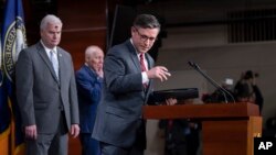 Republican House Speaker Mike Johnson, joined from left by Majority Whip Tom Emmer and Majority Leader Steve Scalise, departs after meeting with reporters at the Capitol in Washington, Feb. 14, 2024.