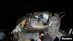 A damaged compartment is seen following the deadly collision of two trains, in Balasore, India, June 2, 2023, in this screen grab obtained from a video. (ANI/Reuters TV via Reuters)