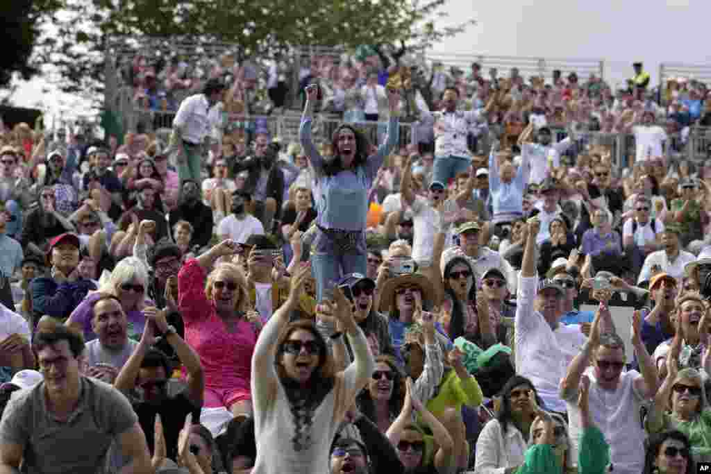 Spectators watch the men&#39;s singles final between Spain&#39;s Carlos Alcaraz and Serbia&#39;s Novak Djokovic on day fourteen of the Wimbledon tennis championships in London.