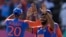 India's Jasprit Bumrah, right, celebrates with teammate Axar Patel after the dismissal of England's Phil Salt during the ICC Men's T20 World Cup second semifinal cricket match in Providence, Guyana, June 27, 2024.