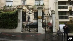 FILE - A police officer guards the Iranian embassy and consulate, April 19, 2024, in Paris. On July 3, 2024, France expelled an Iranian suspected of influence peddling on behalf of Tehran. 