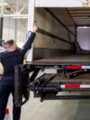 Police officers open the back of the truck used in the heist after authorities gave details of the arrests made a year after 6,600 gold bars and nearly $2 million in cash were stolen from Toronto Pearson International Airport, April 17, 2024.