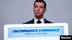 Jordan Bardella, president of the far-right National Rally (RN) party, attends a press conference to present policy priorities as part of the campaign for the upcoming French parliamentary elections, in Paris, June 24, 2024. 