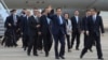 Former Taiwan President Ma Ying-jeou, center, waves as he arrivers with his delegation at the Pudong airport in Shanghai, China, March 27, 2023, in this photo released by Ma Ying-jeou Office.