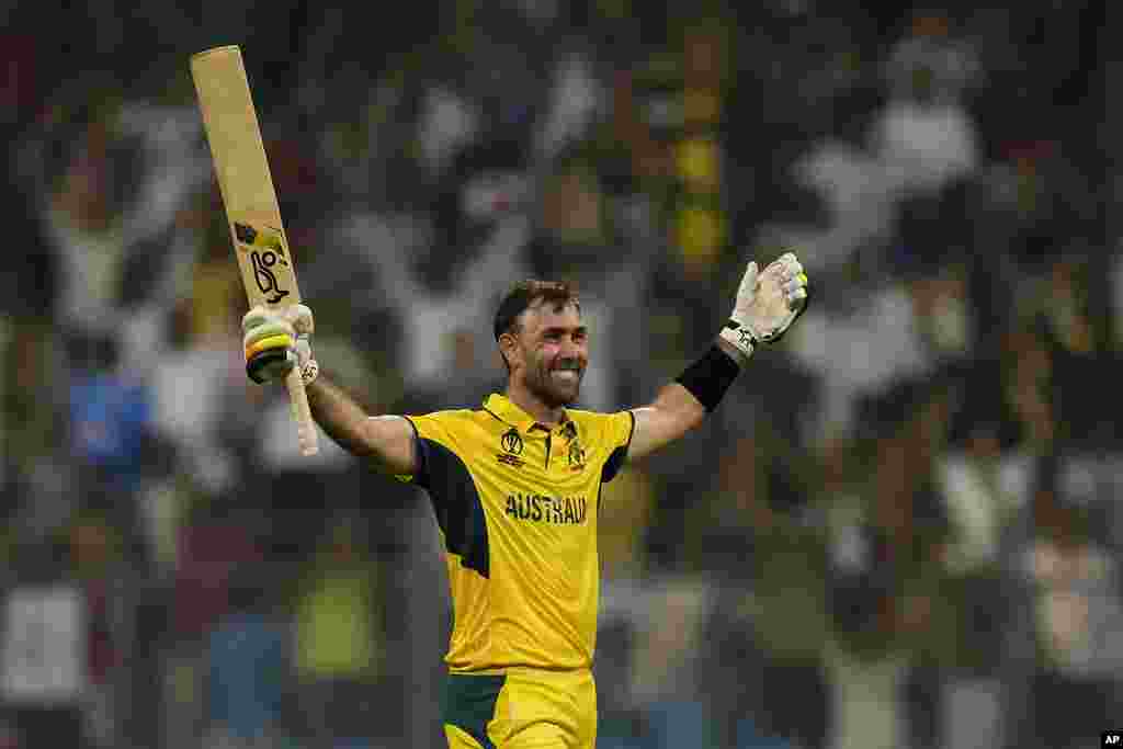 Australia's Glenn Maxwell celebrates after a win in the ICC Men's Cricket World Cup match against Afghanistan in Mumbai, India.