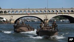 French soldiers patrol on the Seine river in Paris, July 17, 2024.