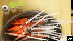 FILE - Pre-loaded syringes with COVID-19 vaccine are ready for use in New Orleans, Jan. 25, 2022. Food and Drug Administration advisers on June 15, 2023, discussed whether the next round of shots should protect only against the newest omicron strains.