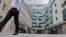 FILE - A view of the main entrance to the headquarters of the publicly funded BBC in London, July 19, 2017. Senior British politicians called on the BBC, July 9, 2023, to rapidly investigate a complaint that a leading presenter paid a teenager for explicit photos. 