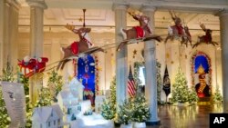Holiday decorations adorn the Grand Foyer of the White House for the 2023 theme &quot;Magic, Wonder, and Joy&quot; in Washington. (AP Photo/Evan Vucci)