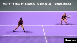 FILE - Taiwan's Hsieh Su-we, left, and Czech Republic's Barbora Strycova play in a doubles final at the WTA Tour tournament at Shenzhen, China, in 2019 - the last year women's tennis' governing body held tournaments in China. 