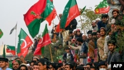 Supporters of former prime minister Imran Khan's Pakistan Tehreek-e-Insaf party protest against the alleged skewing in Pakistan's national election results, in Peshawar, Feb. 17, 2024. 