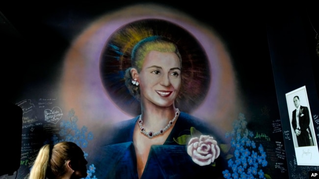 FILE - A mural of Argentine former first lady Eva Perón, or Evita, depicting her with a saint's halo, adorns a wall inside the Peron Peron restaurant in the San Telmo neighborhood of Buenos Aires, Argentina, Feb. 9, 2024.