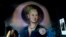 FILE - A mural of Argentine former first lady Eva Perón, or Evita, depicting her with a saint's halo, adorns a wall inside the Peron Peron restaurant in the San Telmo neighborhood of Buenos Aires, Argentina, Feb. 9, 2024. 