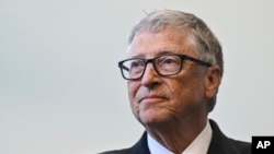 FILE - Bill Gates reacts during a visit with Britain's Prime Minister Rishi Sunak at the Imperial College University, in central London, on Feb. 15, 2023.