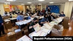 Officers prepare mail ballot packages for the Thailand General Election absentee voting in the US at the Royal Thai Consulate General Los Angeles, CA, April 19, 2023