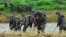 South Korean marines search for missing people in floodwaters in Yecheon, South Korea, July 18, 2023. 