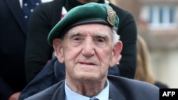 FILE - French War veteran Leon Gautier attends a ceremony a day ahead of the start of D-Day commemorations, in Ouistreham, June 5, 2014.